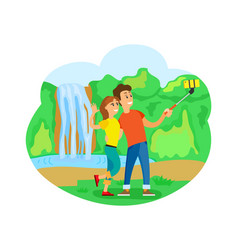 Travelers Couple At Waterfall Taking Selfie Trip