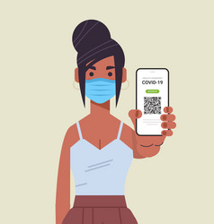 Woman In Mask Holding Digital Immunity Passport