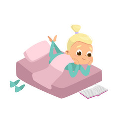 Cute Girl Reading Book In Her Bed Before Bedtime