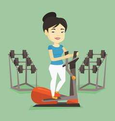 Woman Exercising On Elliptical Trainer