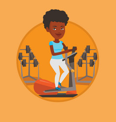 Woman Exercising On Elliptical Trainer