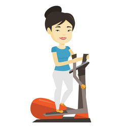 Woman Exercising On Elliptical Trainer