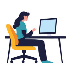 Businesswoman Sitting At Desk Using Computer