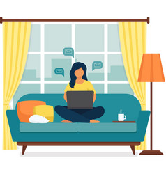 Young Woman Sitting With Laptop On The Sofa