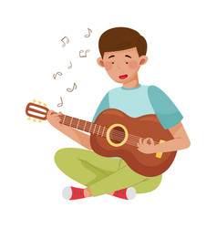 Young Man Playing Guitar To Reduce Stress