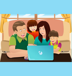 Happy Family Looking At A Laptop