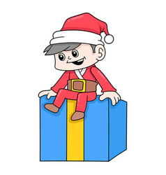 Boy Wearing Santa Claus Sitting In Gift Box