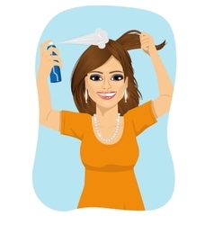 Woman Spraying Her Hair With Dry Shampoo