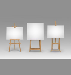 Set Of Brown Wooden Easels With Blank Canvases