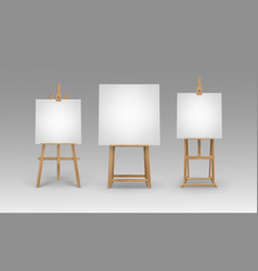 Set Of Wooden Easels With Empty Canvases