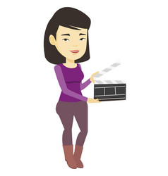 Smiling Woman Holding An Open Clapperboard