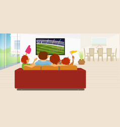 Family Sitting On A Sofa Watching A Soccer Game