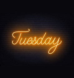 Tuesday Neon Sign On Brick Wall Background