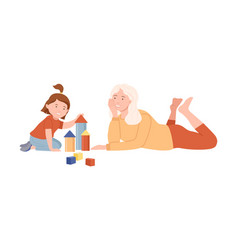 Grandma And Granddaughter Playing Toy Blocks