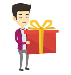 Joyful Asian Man Holding Box With Gift