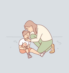 Caring Mother Consoles Crying Son Who Injured Knee