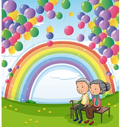 An Old Couple Below The Floating Balloons