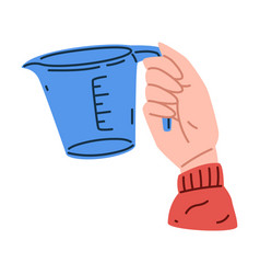 Hand Holding Measuring Cup As Cooking Utensil