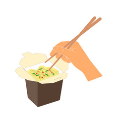 Wok Noodles In Box And Hand Holding Chopsticks