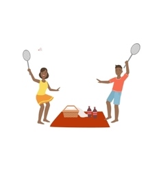 Couple Playing Badminton On Picnic