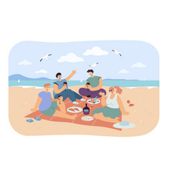 Group Of Happy Friends Having Picnic On Beach