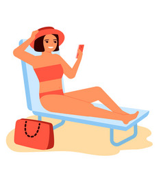 Young Woman Sunbathes In Swimsuit On Sun Lounger