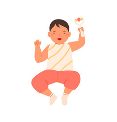 Cheerful Cute Baby Lying Holding Rattle