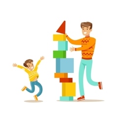 Dad And Son Building A Tower With Blocks Happy