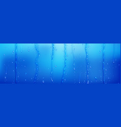 Water Droplets And Streams On Blue Surface