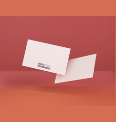 Two White Business Cards On A Corral Background