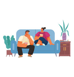 Couple Sitting On Sofa Cuddling And Eating Popcorn