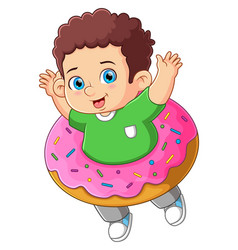 A Cute Boy Playing With Big Strawberry Donut Toy