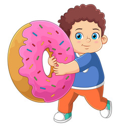 A Cute Boy Playing With Big Pink Donut Toy