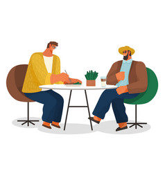 Two Men Friends Sitting At A Table Eating