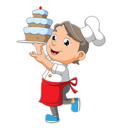 Chef Boy Is Holding A Cake