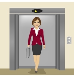 Businesswoman Coming Out Of Office Elevator