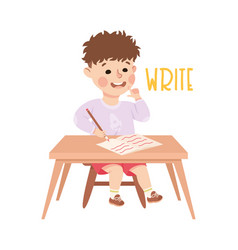 Little Boy At Desk Writing In Copybook