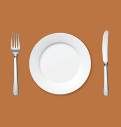 Empty Plate With Fork And Knife On The Table