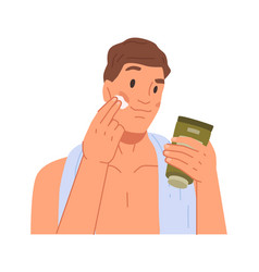 Man Applying Aftershave Cream On Face Skin