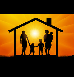 Family With Three Children In House At Sunset