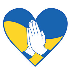 Hands Folded In Prayer On A Blue And Yellow Heart