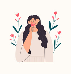 Smiling Woman Smelling Flower