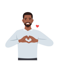 Young Man Making Or Gesturing Heart Symbol With