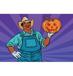 African American Farmer With A Halloween Pumpkin