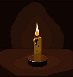 Burning Candle In The Dark Against Wall