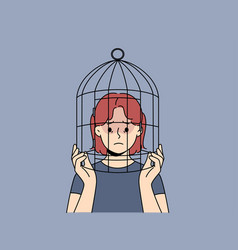 Unhappy Teen Girl With Head In Birdcage