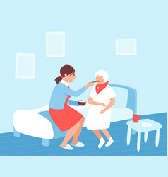 A Nurse Feeds An Elderly Woman In Nursing Home