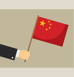 Hand Holding Chinese Flag