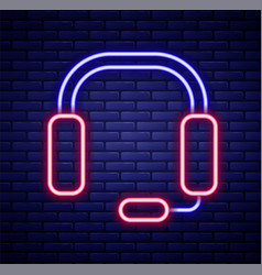 Glowing Neon Line Headphones Icon Isolated