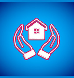 White House In Hand Icon Isolated On Blue